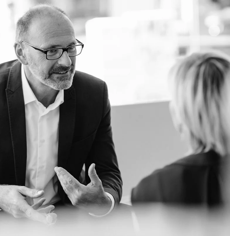 Professional business consulting team discussing strategy and working together in a modern office